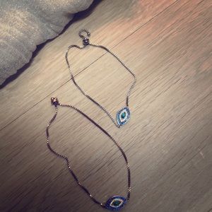 Delicate silver and gold eye bracelets